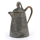 Indian copper jug with serpent handle profusely engraved and decorated in low relief with flowers,