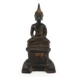 South East Asian partially gilt patinated bronze figure of seated Buddha, possibly from Nepal, 21.