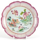 Chinese porcelain flower head dish hand painted in the famille rose palette with two ducks in