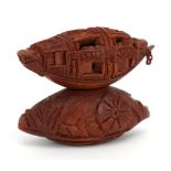 Good Chinese carved coquilla nut junk with opening windows and inscribed poem, raised on a