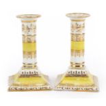 Pair of early 19th century Chamberlain's Worcester porcelain candlesticks with gilt decoration, each