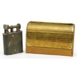 Large Dunhill style silver plated table lighter and a brass roll top cigarette dispenser, the