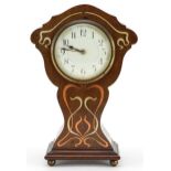 Art Nouveau mahogany mantle clock with copper and white metal inlay having a circular dial, 25.5cm