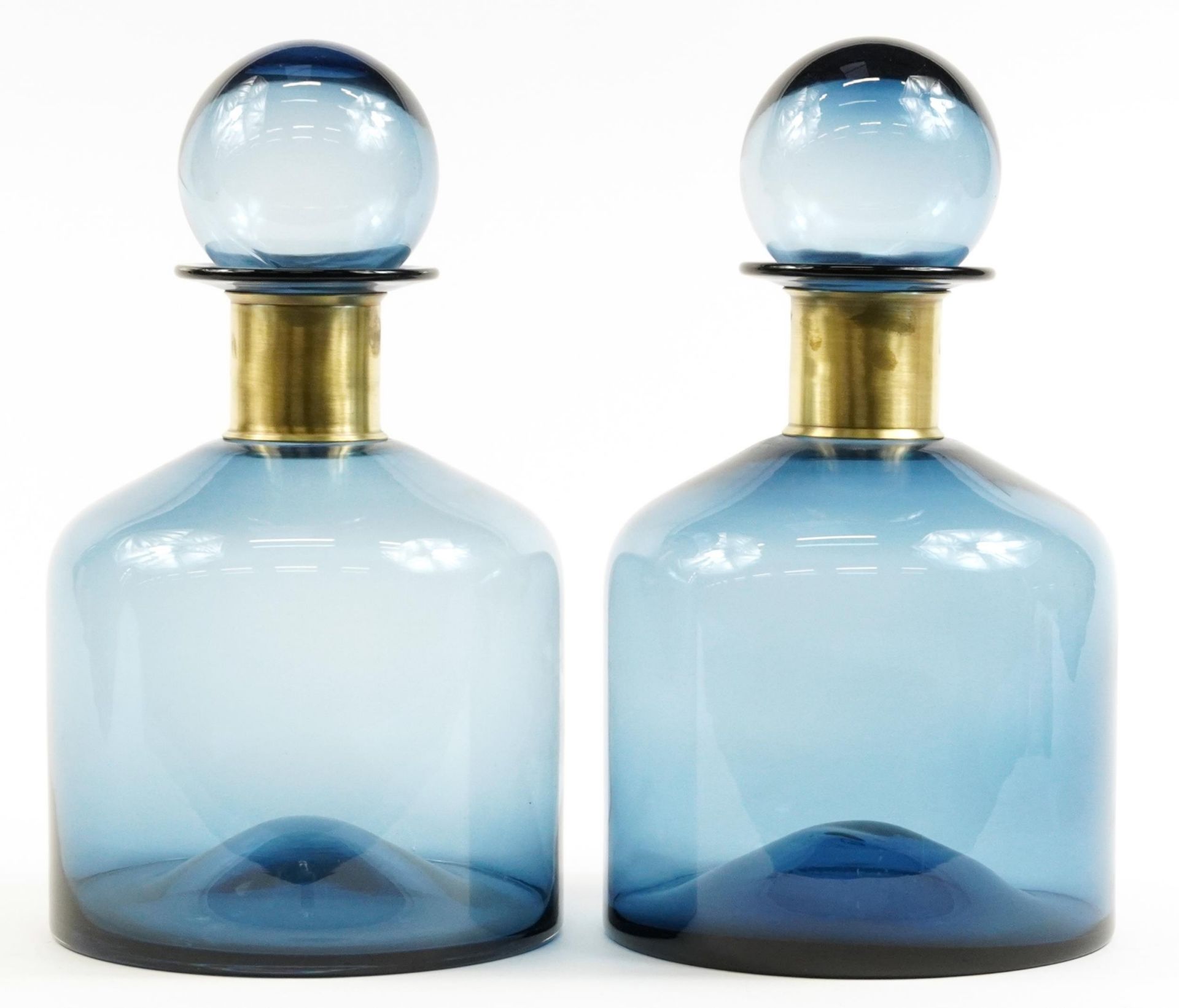 Pair of oversized blue glass display scent bottles with stoppers in the style of Holmegaard, each