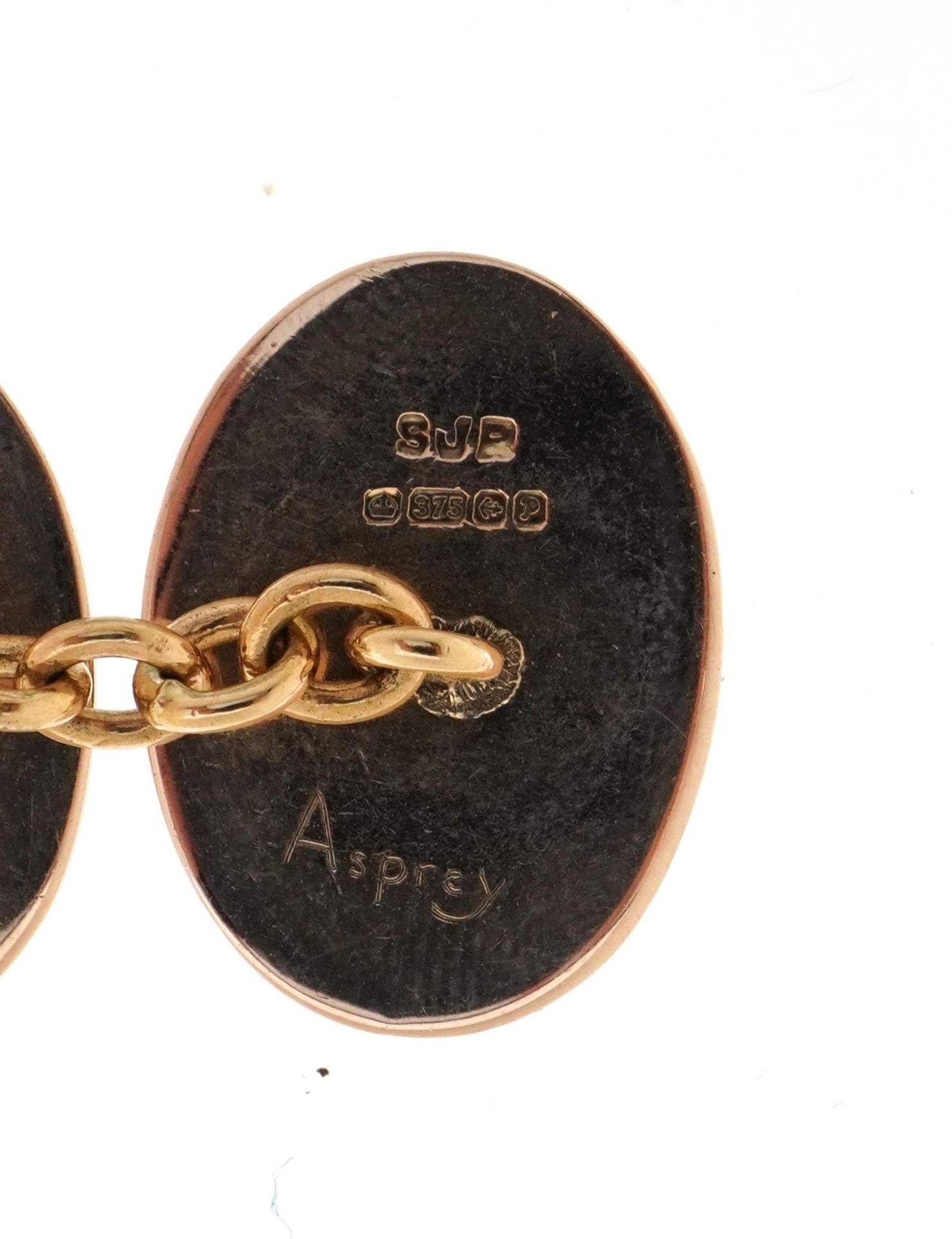 Pair of 9ct gold, red and white enamel cufflinks retailed by Asprey, housed in a Suttons & Robertson - Image 3 of 5