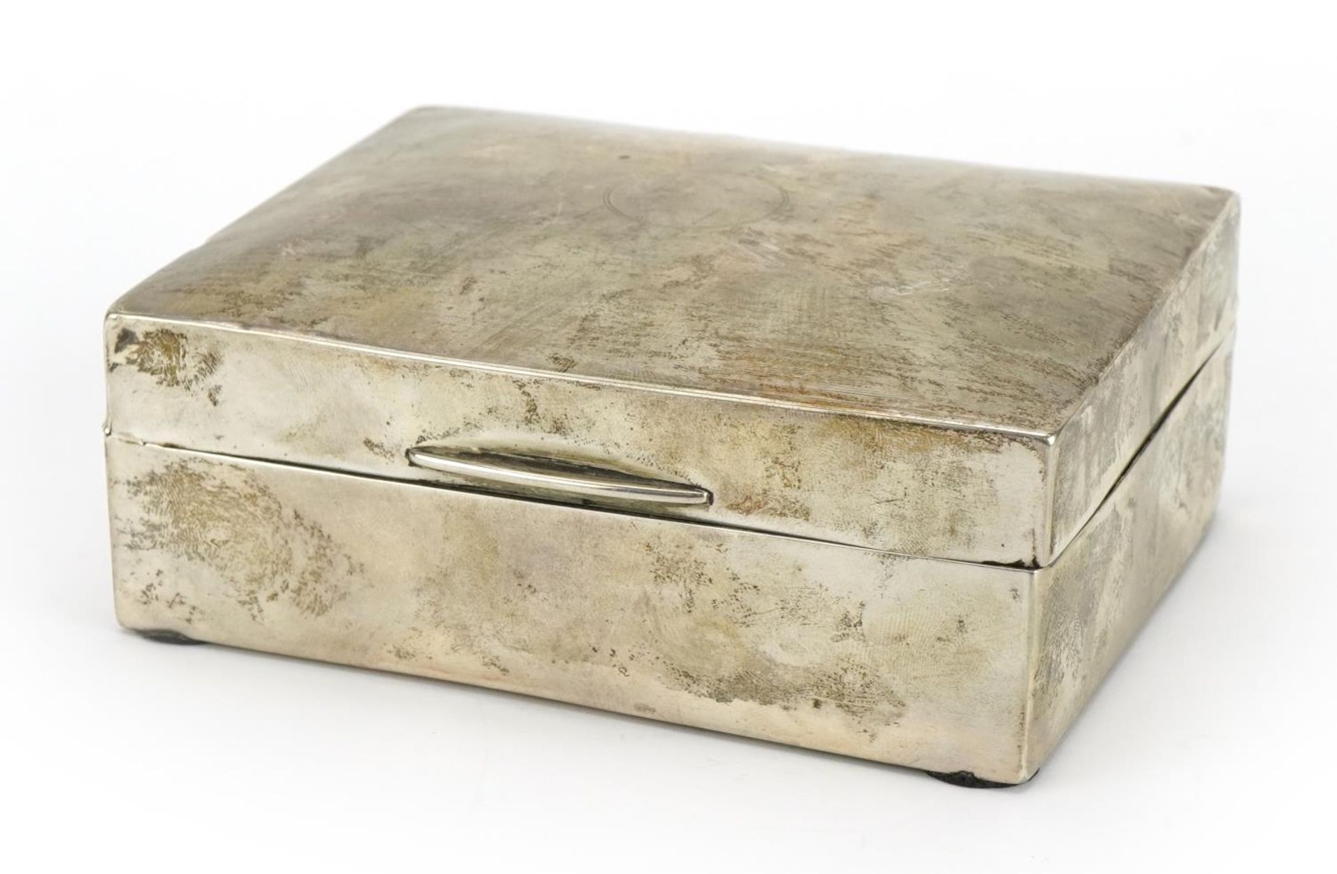 William Neale rectangular silver cigarette box with hinged lid, the hinged lid with engine turned