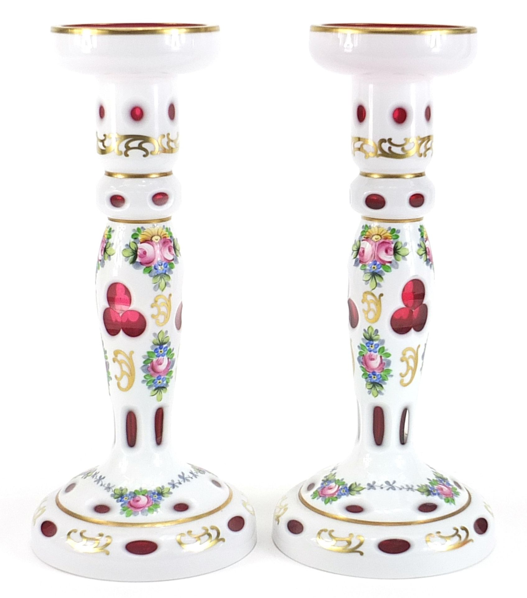 Attributed to Moser, pair of Bohemian white overlaid cranberry glass candle holders, hand painted