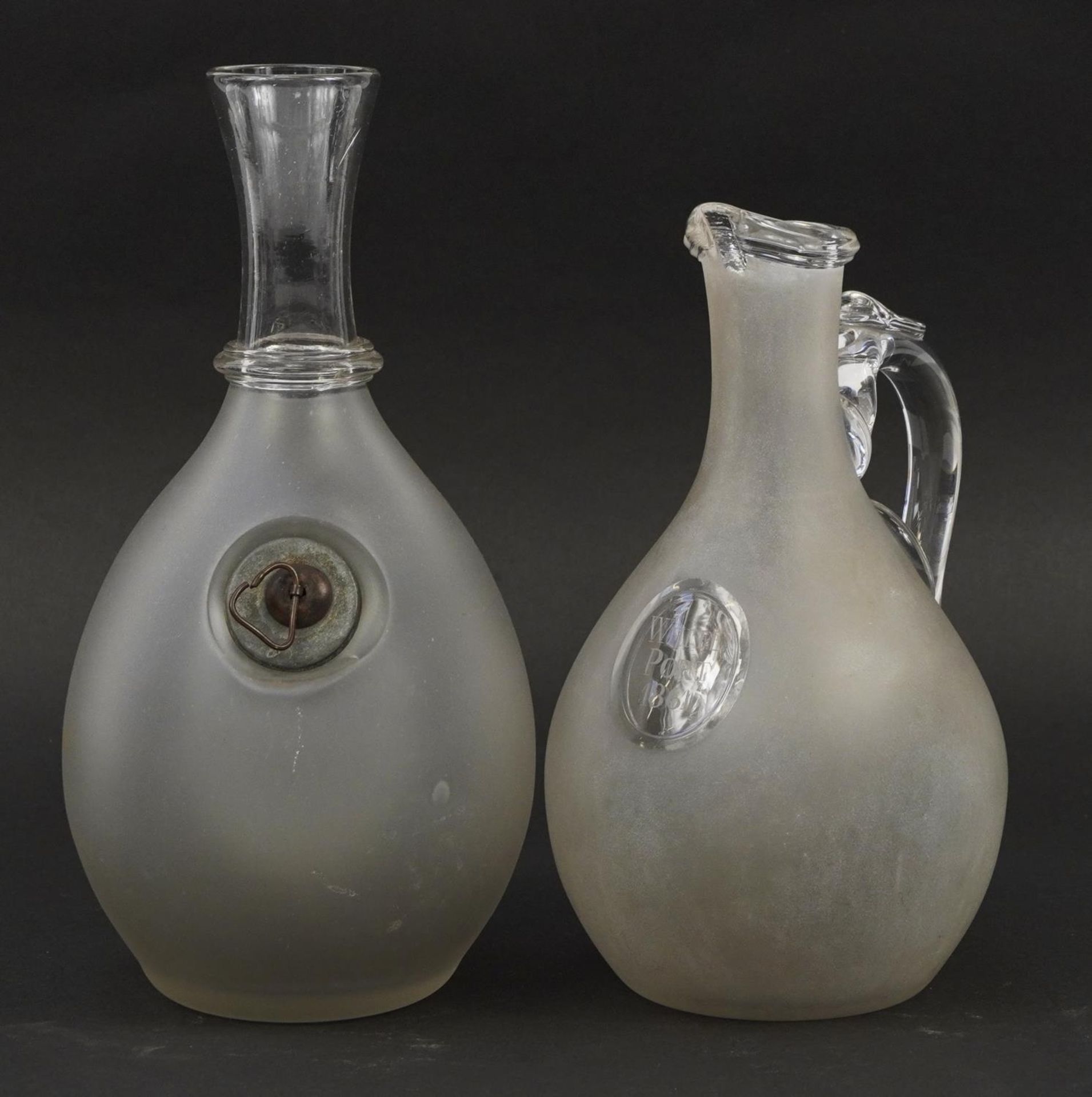 Two Victorian frosted and clear glass carafes, one etched White Port 1861, the largest 27.5cm high