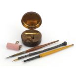 Victorian unmarked silver dip pen, two similar wooden examples, leather cased brass inkwell and a