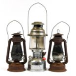 Three vintage lanterns including Anchor no 950, the largest 41.5cm high