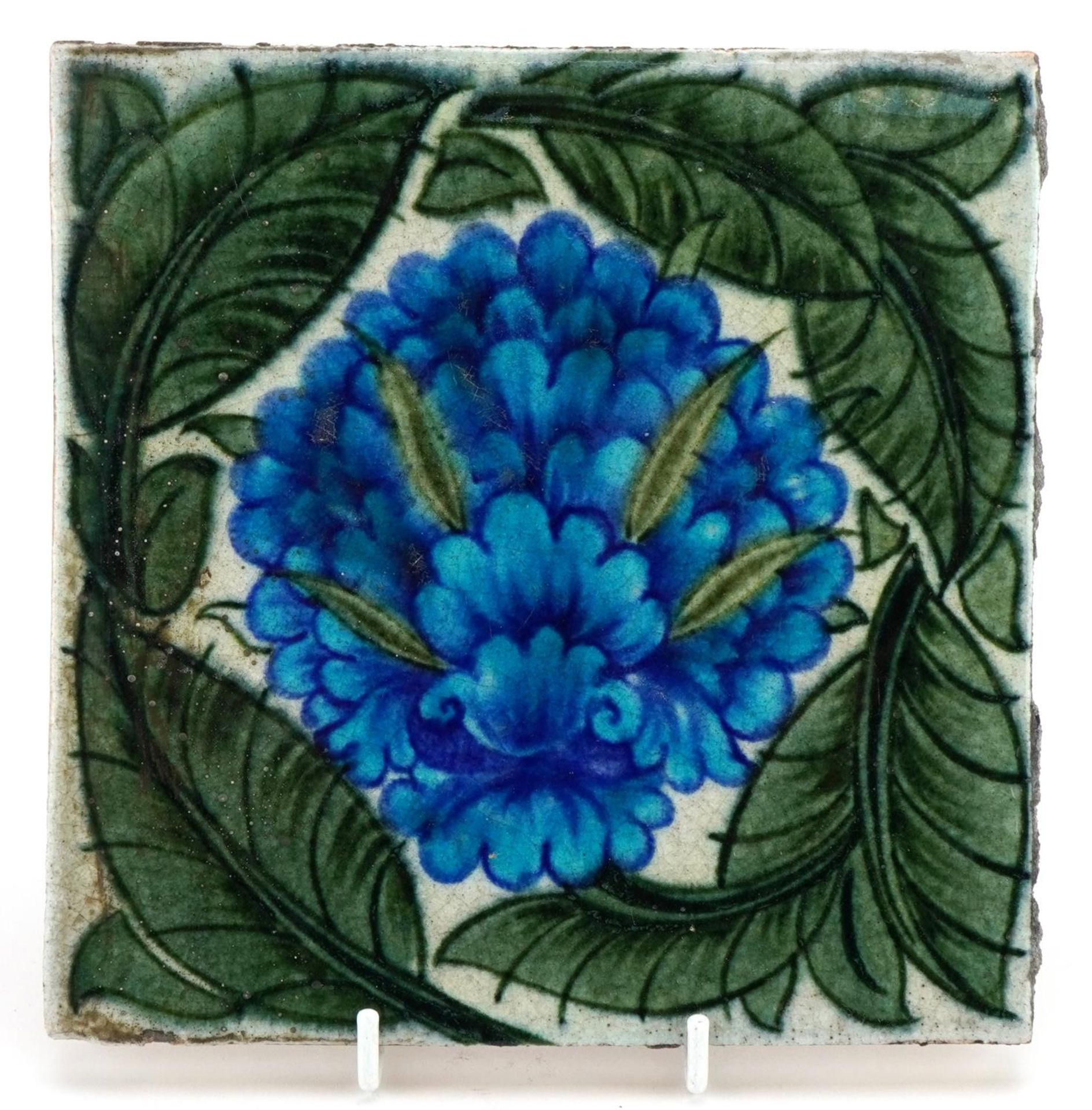 William De Morgan for Merton Abbey, Arts & Crafts pottery tile hand painted with a stylised flower