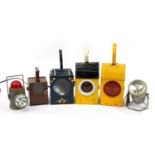 Six vintage and later railway interest lanterns, some enamelled, the largest 25.5cm high