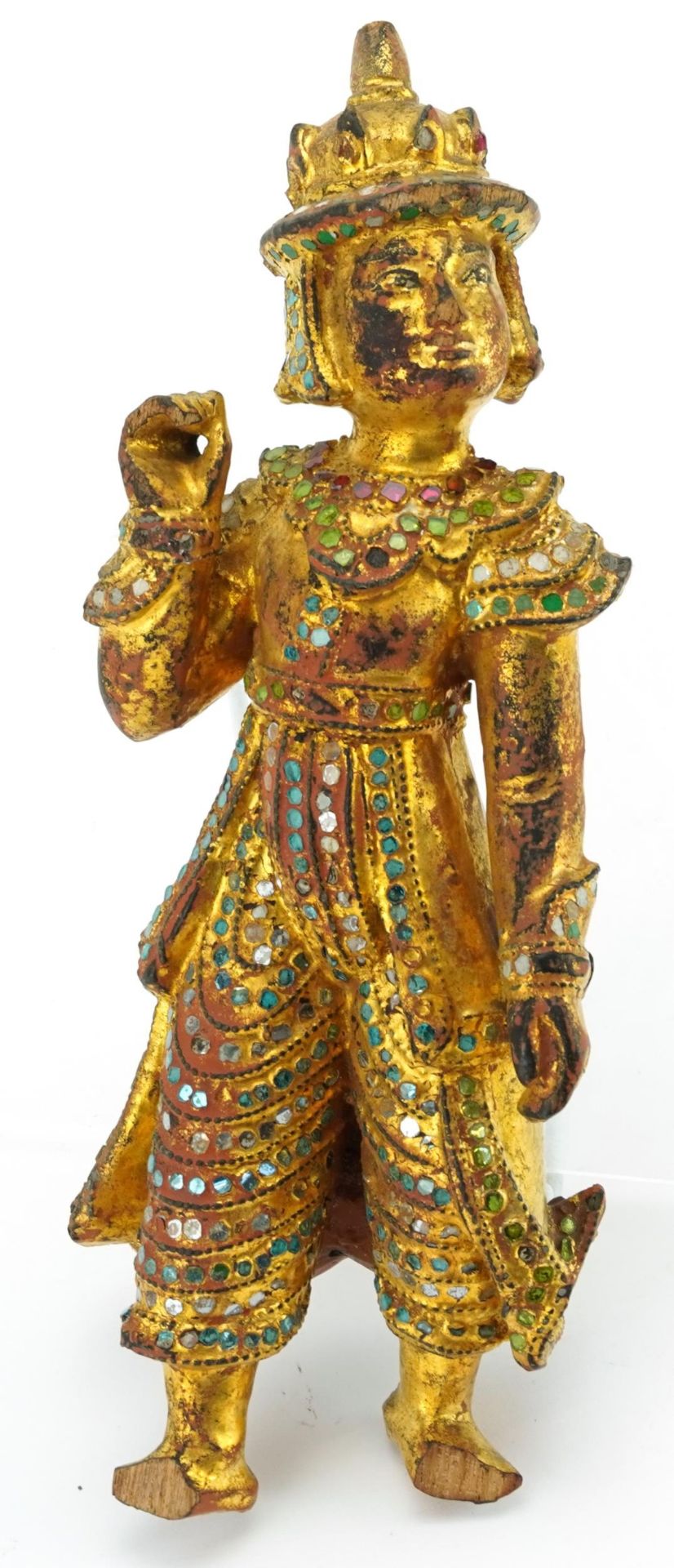 Balinese giltwood carving of a goddess with coloured glass inlay, 29cm high