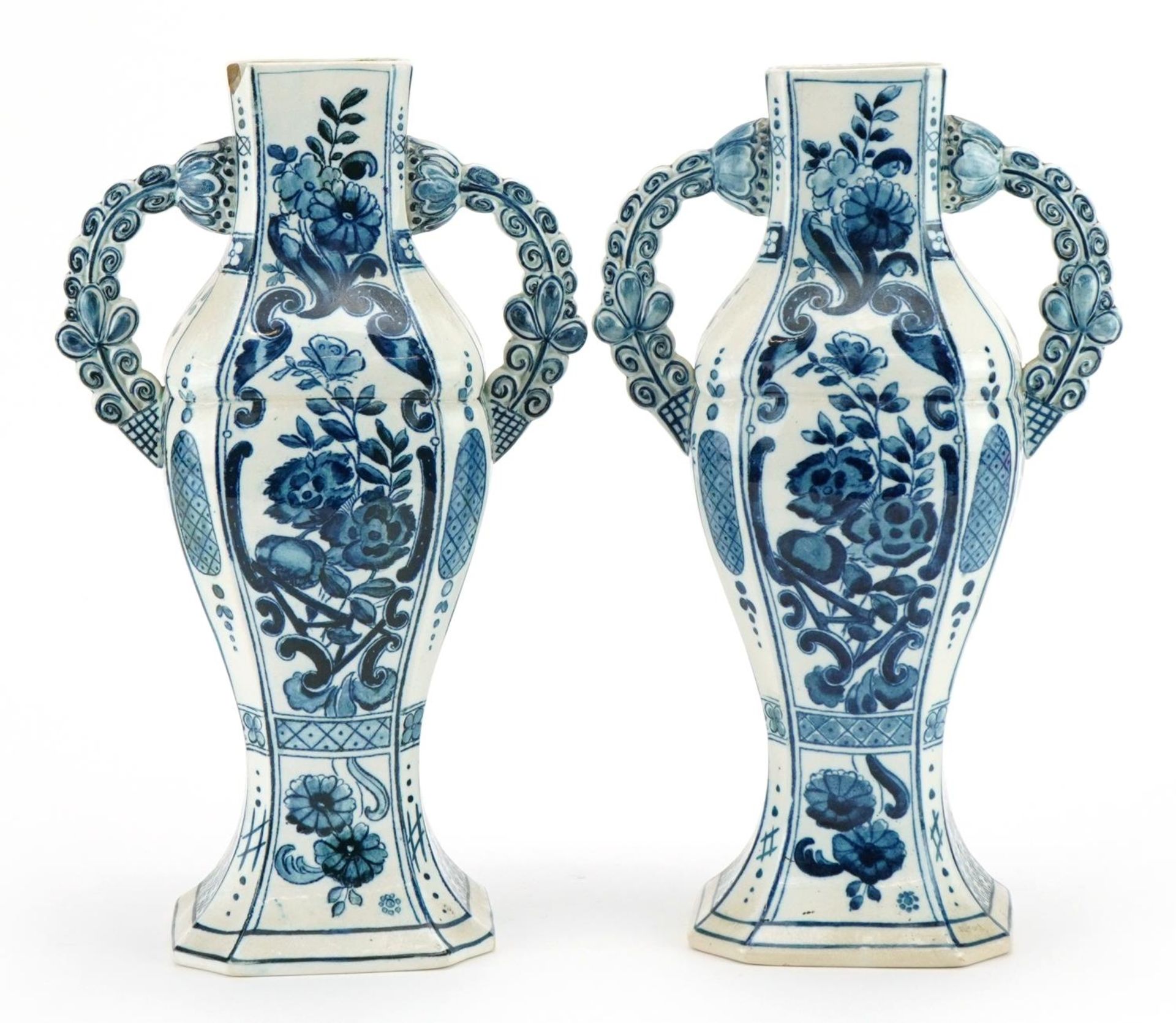 Villeroy & Boch, pair of Dutch Delft tin glazed vases with twin handles hand painted with flowers,