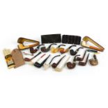 Collection of Meerschaum style smoking pipes including one with carved Maori type bowl and