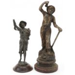 Two antique spelter figures of a miner and beggar boy, the largest 37cm high