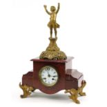 French red marble and gilt metal figural mantle clock striking on a bell with circular dial