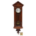 Mahogany cased Vienna Regulator wall clock with visible pendulum and weights, 122cm high