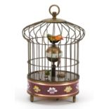 Brass and cloisonne clockwork automaton birdcage with alarm clock, 19.5cm high