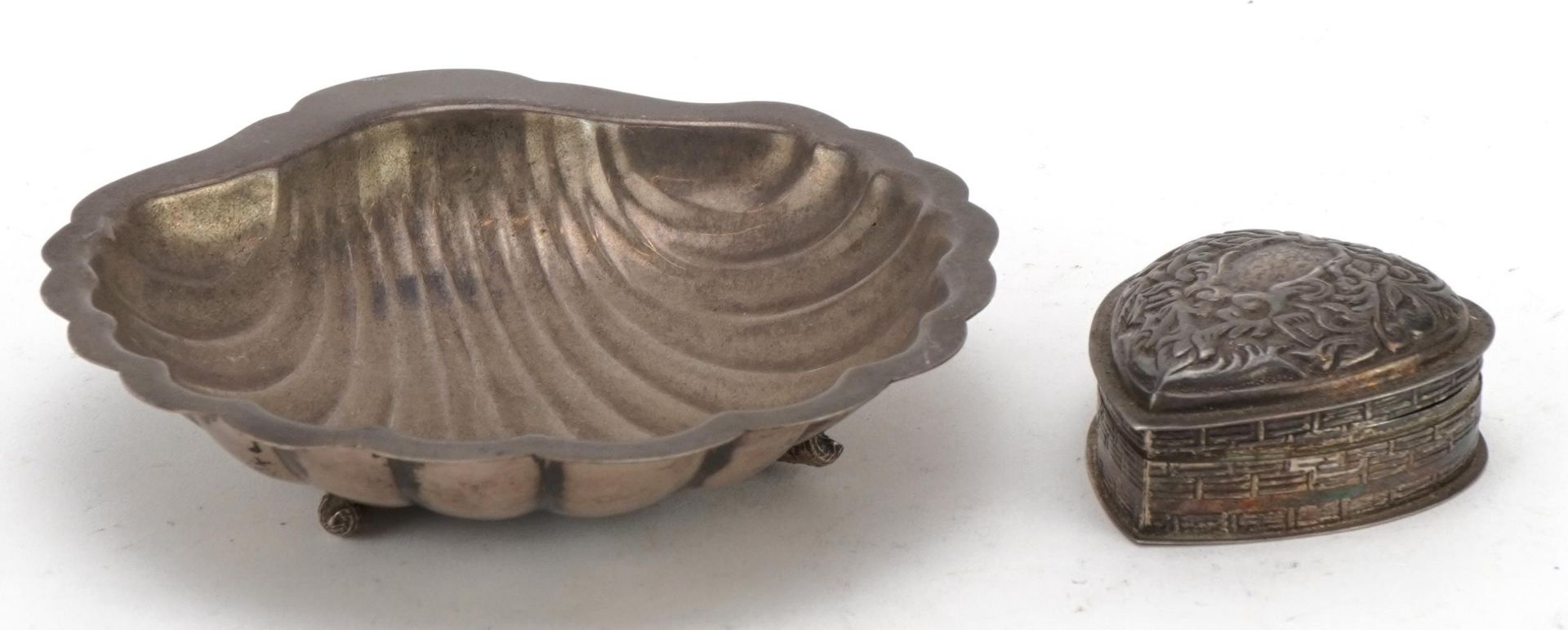 Egyptian silver shell shaped dish and a silver love heart shaped box with hinged lid, the largest