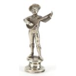 Unmarked silver pipe tamper with seal in the form of a Mexican musician, 5.5cm high, 21.3g