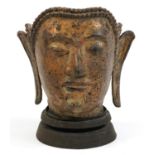 Chino Tibetan gilt bronze Buddha head raised on stand, 31cm high