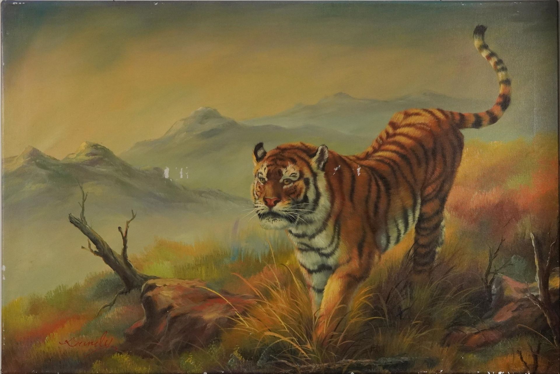 Tiger before a mountainous landscape, oil on canvas, indistinctly signed, possibly Bundy,