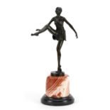 Large patinated bronze figurine of an Art Deco dancer raised on a circular marble and black slate