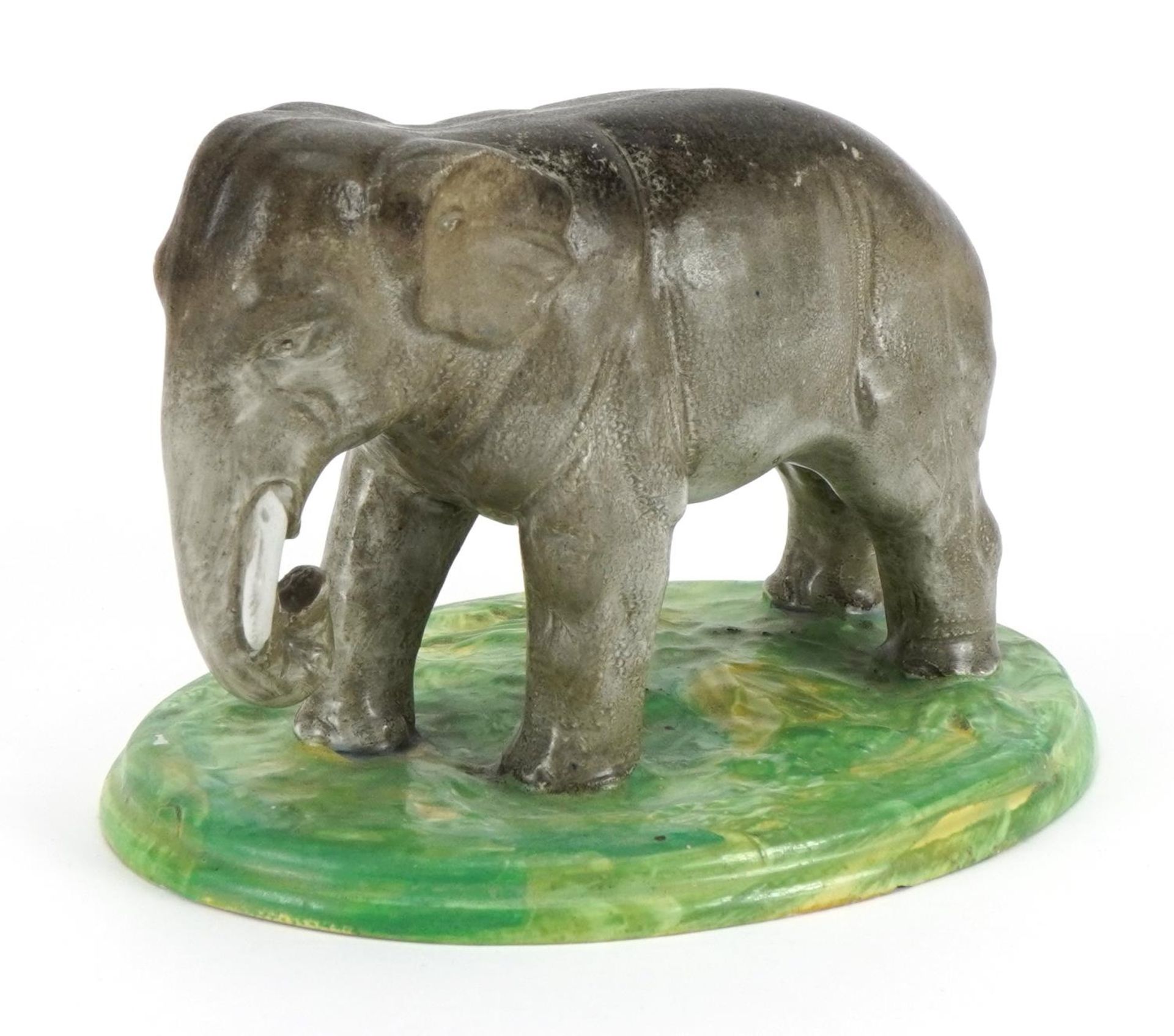 19th century pearlware model of an elephant, 21cm in length