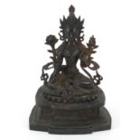 Chino Tibetan patinated bronze figure of Buddha, character marks to the reverse, 27cm high