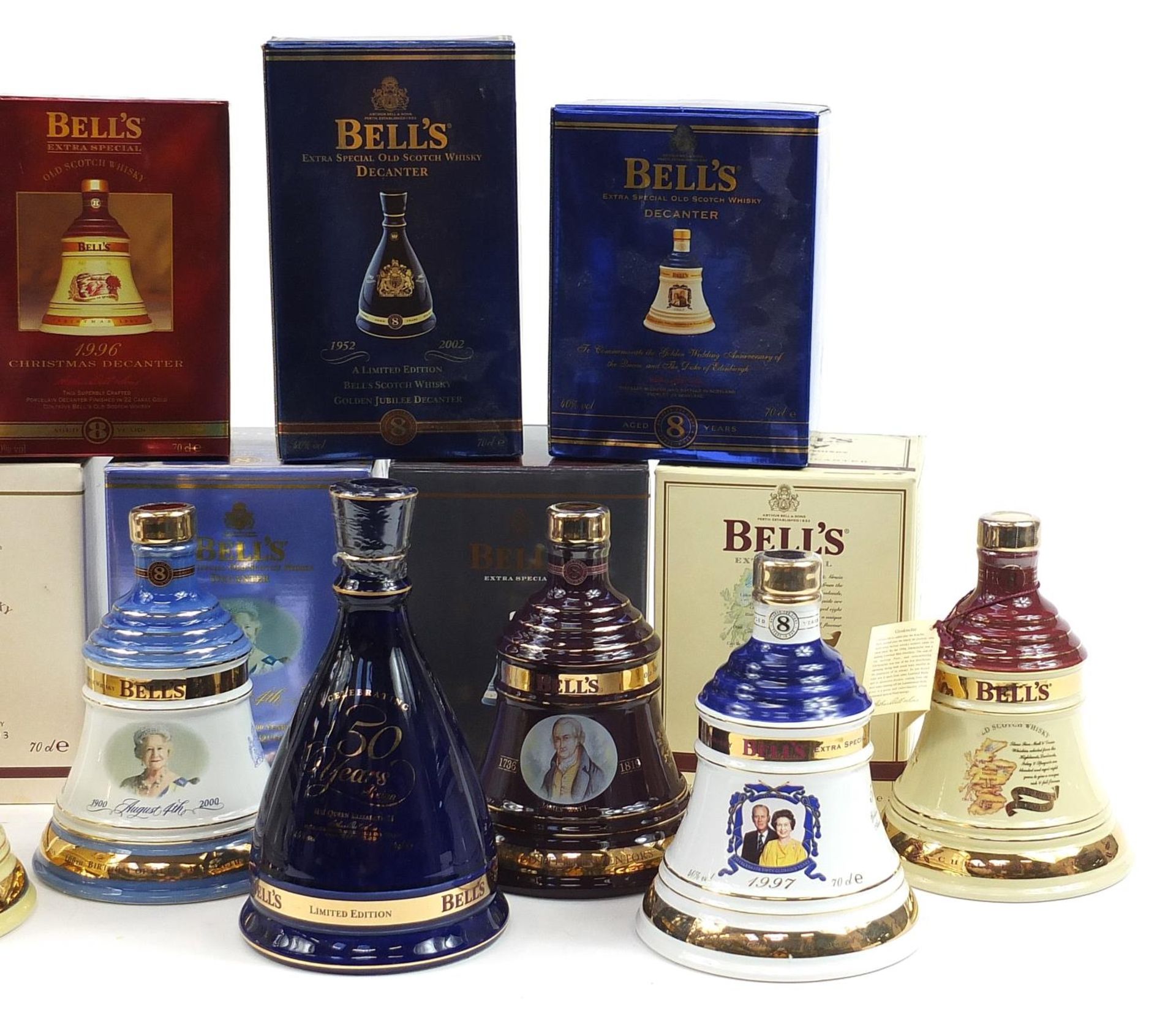 Eight Bells 8 Year whisky commemorative sealed decanters with contents, seven with boxes, - Image 3 of 3