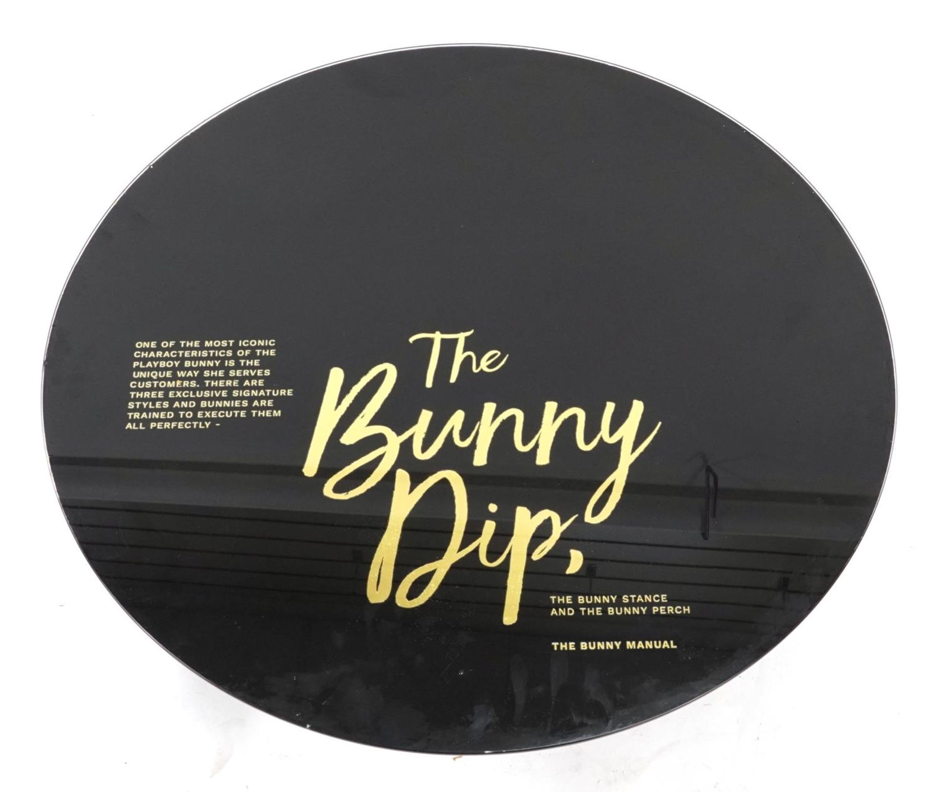 Circular glass Playboy bunny table top, The Bunny Dip, 80cm in diameter PROVENANCE: the Playboy
