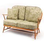 Ercol light elm Windsor two seater settee, 131cm wide