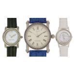 Three ladies wristwatches, one silver, each set with blue sapphires, topaz and aquamarine, with