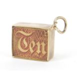 9ct gold emergency ten shilling note charm, 1.3cm wide, 2.2g