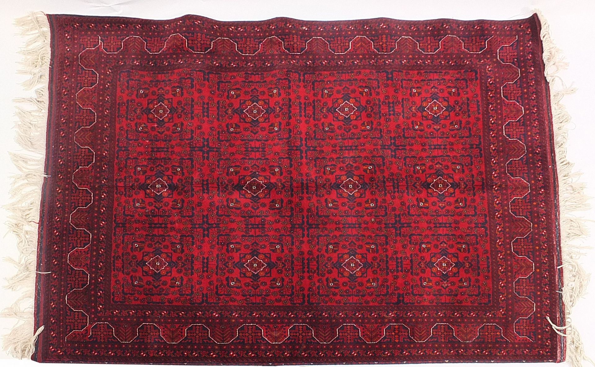 Afghan red and blue ground rug having an all over geometric design, 200cm x 153cm