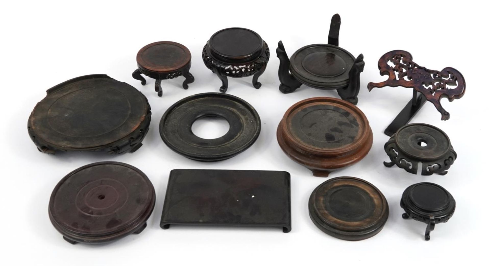 Collection of Antique and later Chinese hardwood stands, some possibly Hongmu, the largest 26cm in
