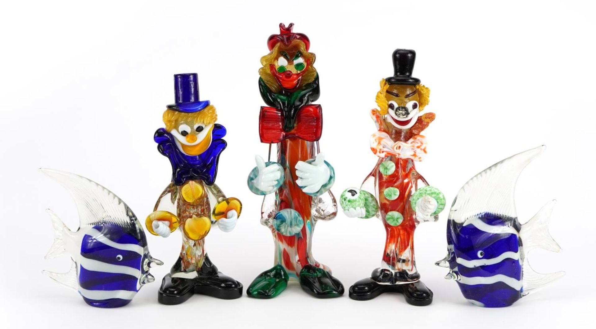 Three Murano glass clowns and two glass fish, the largest 26cm high