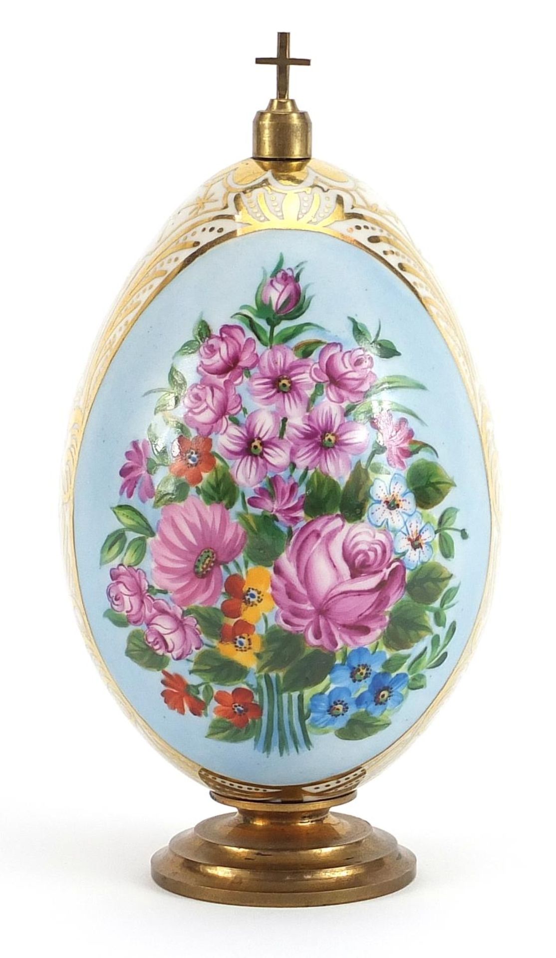 Antique Russian porcelain Easter egg on metal stand with cross, the egg hand painted with panels