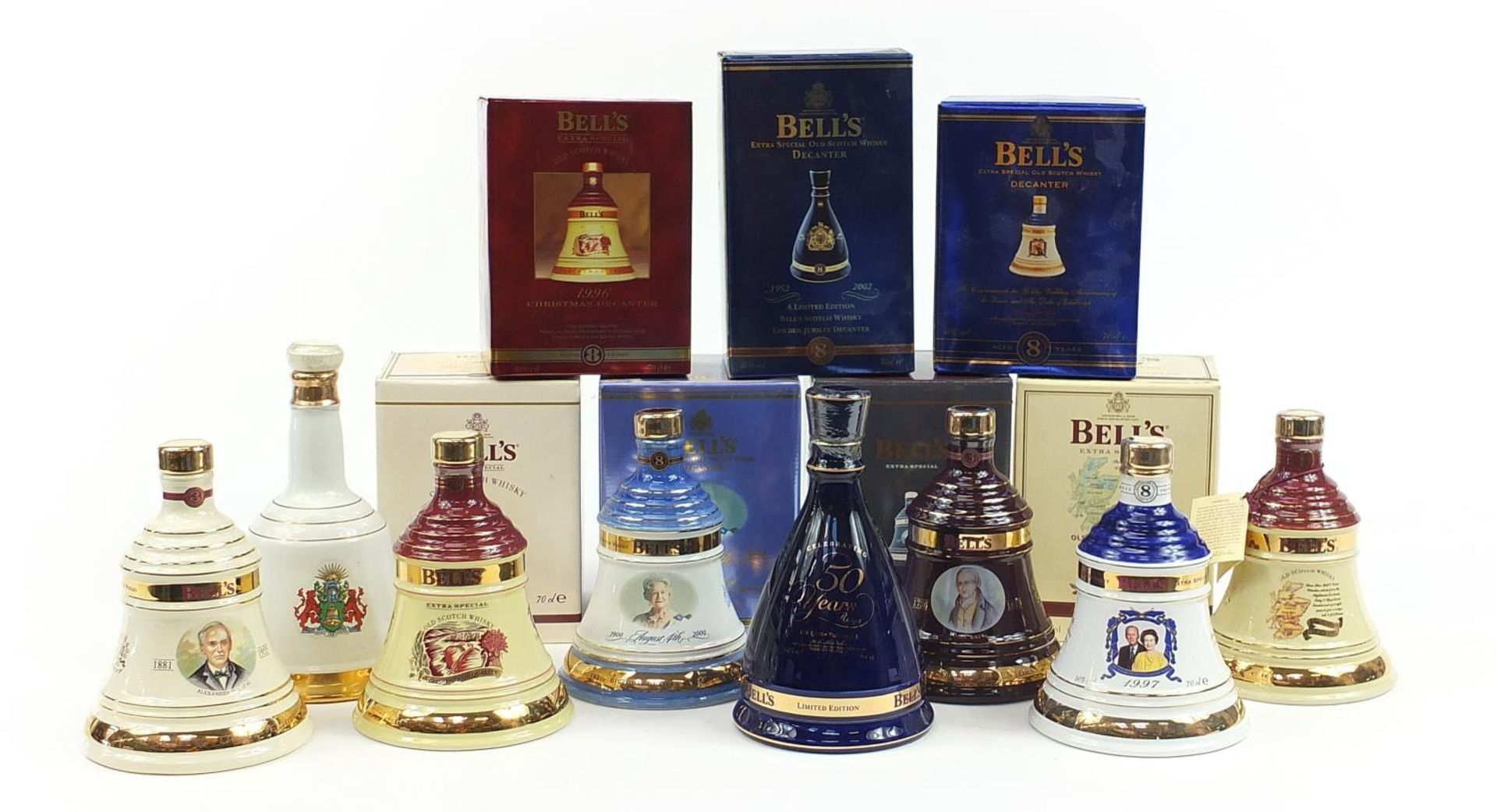Eight Bells 8 Year whisky commemorative sealed decanters with contents, seven with boxes,