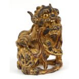 Chinese giltwood carving of a Foo dog, 30.5cm high