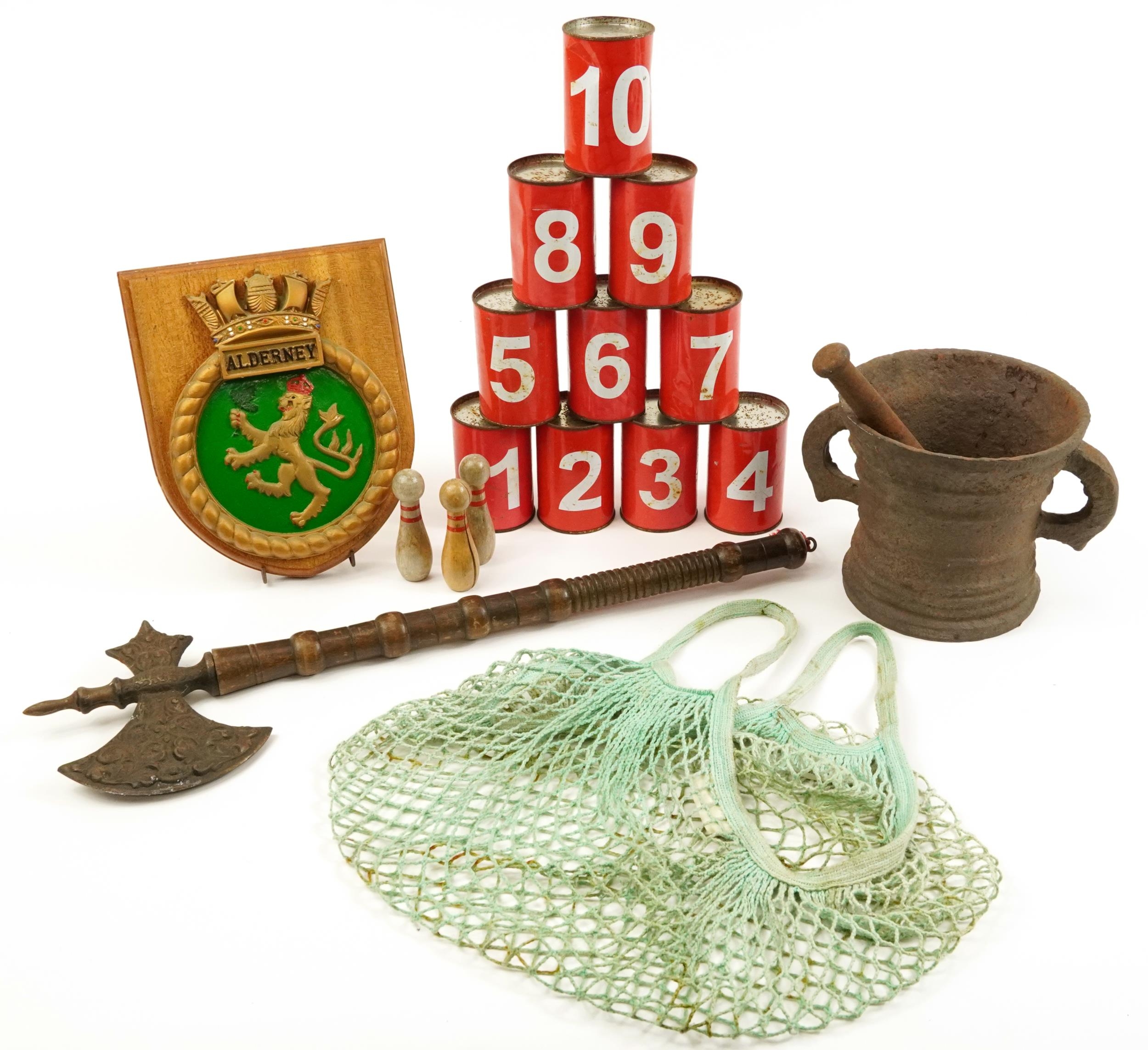 Sundry items comprising medieval style axe, pestle and mortar, Alderney Shipping plaque and skittles