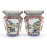 Pair of Chinese porcelain half vase wall pockets hand painted in the famille rose palette with