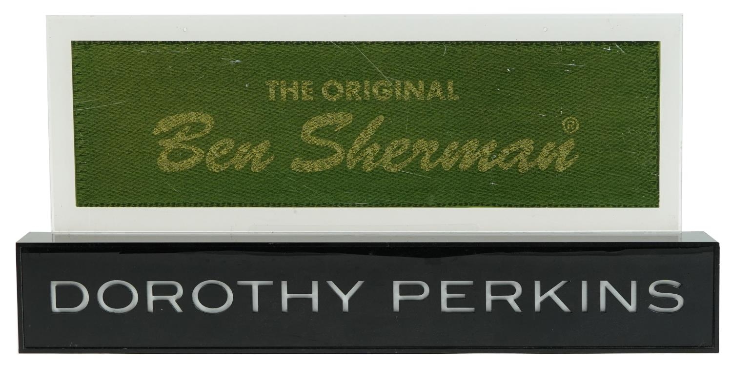 Two shop advertising display signs comprising The Original Ben Sherman and Dorothy Perkins, the