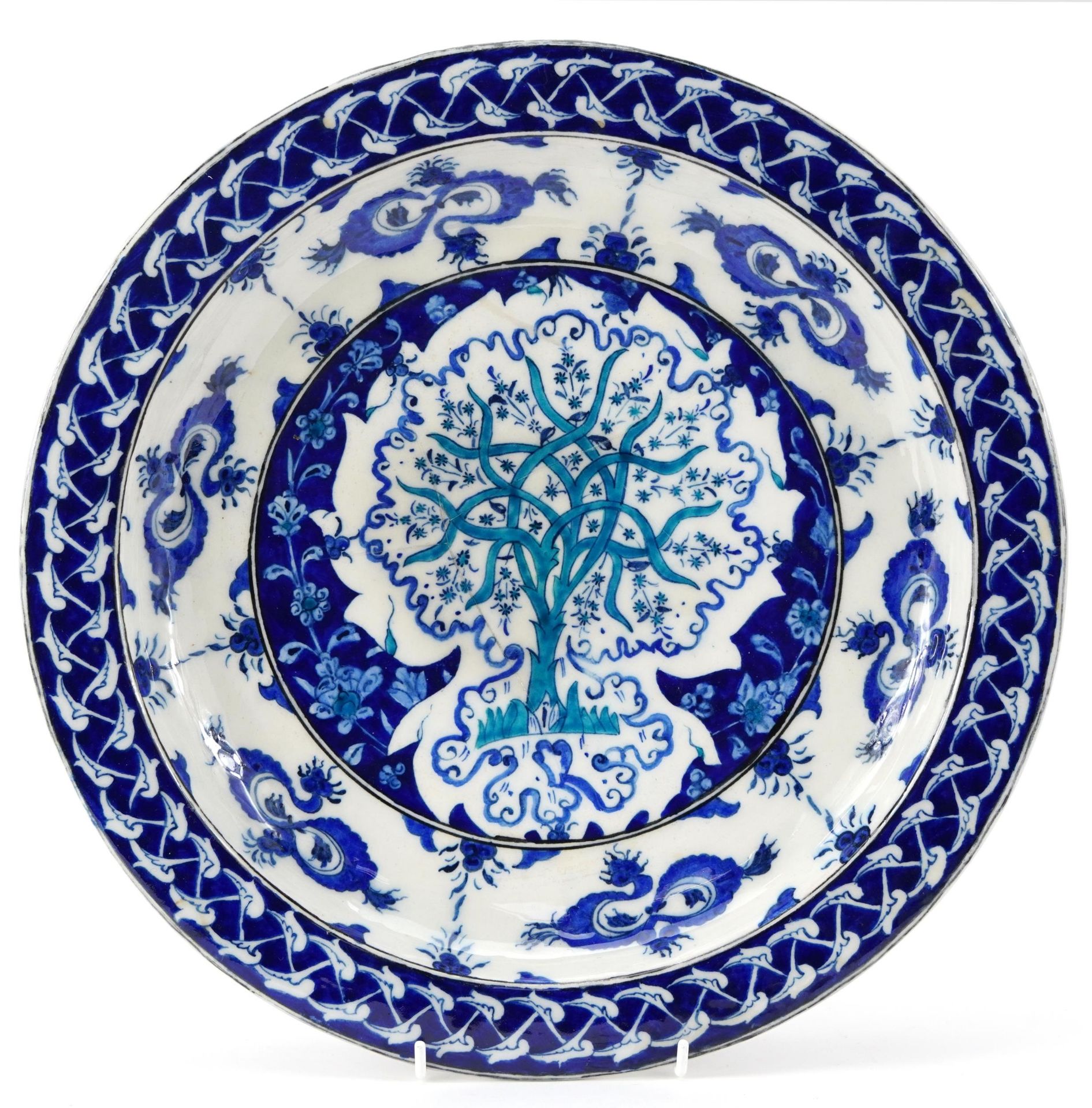 Turkish Iznik pottery charger hand painted with a tree and flowers, 35cm in diameter