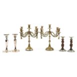 Three pairs of silver plated candelabras and candlesticks including a pair of oak barley twist,