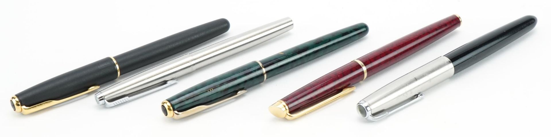 Five Parker and Watermans ballpoint and fountain pens