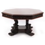 Oak centre table with octagonal top having four frieze drawers on bulbous supports with carved