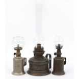 Two vintage French oil lamps and one other, including a Pigeon lamp, the largest 40cm high overall