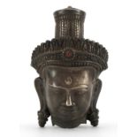 Chino Tibetan silvered metal bust of Buddha with red and green cabochons, 18.5cm high